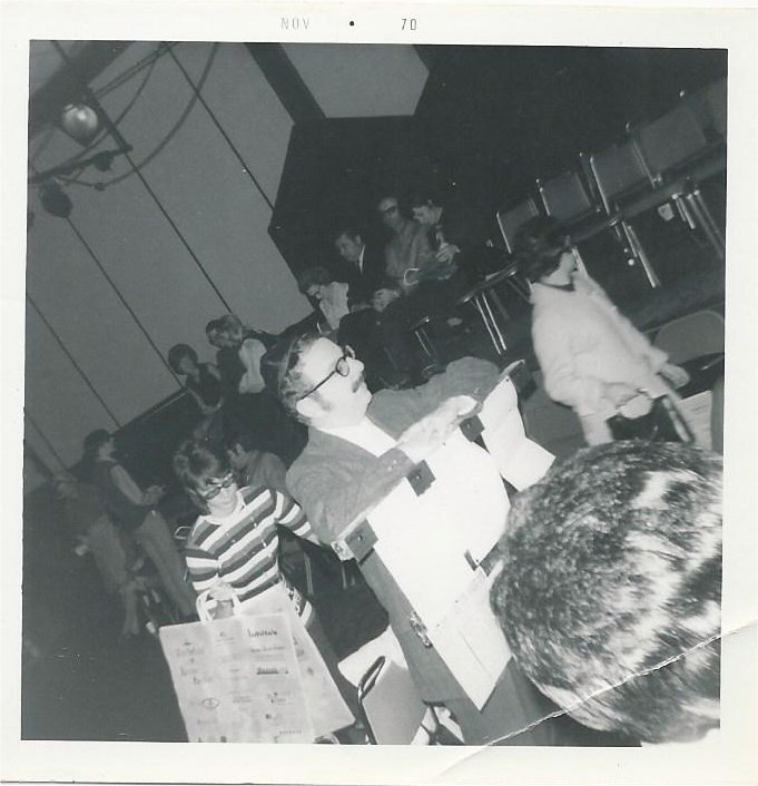 Jerry Leibowitz as Shtettle member helping audience members "find" their seats and offering socks for sale just before the performance of The World of Shalom Aleichem