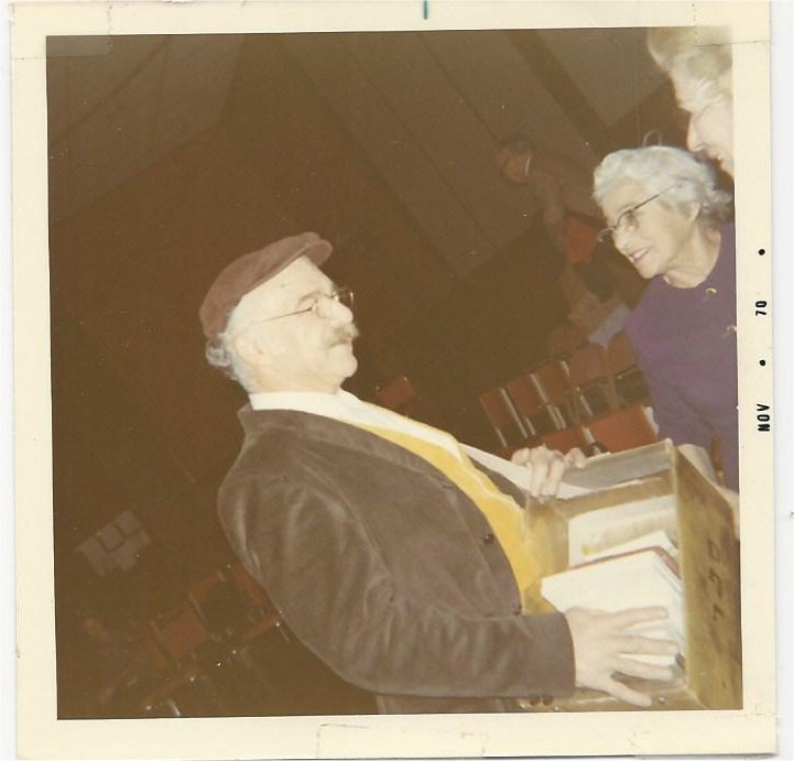 Julian Barnett as the Book Peddler with audience member