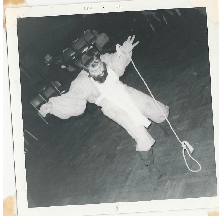 Benton Bloch, as Shtettle members creating a "goat" out of a piece of rope in A Tale of Chelm during a rehearsal the World of Shalom Aleichem