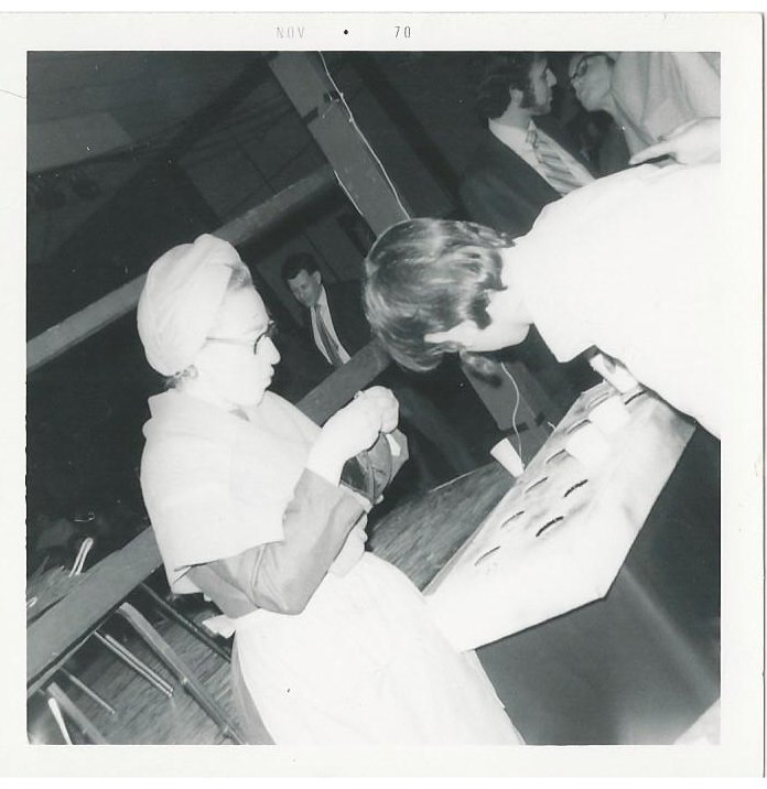 Roz Sonnenstein, as a Schtettle member, preparing her inventory for sale during preperformance welcoming of the audience in the lobby and during the intermission